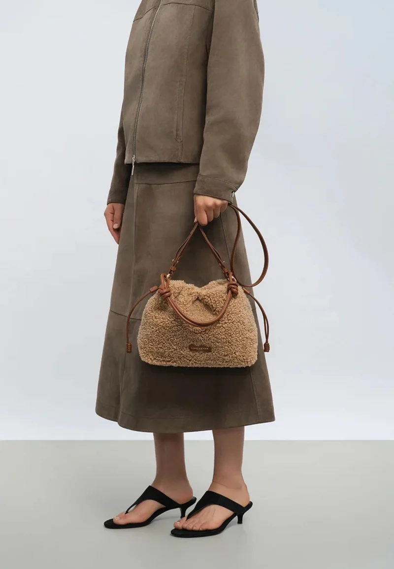Lancaster Sac besace A lacets coulissants M Moumoute Cognac
